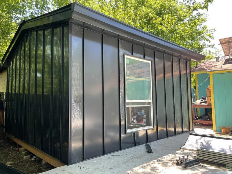 Black standing seam metal wall panels for Roof Inspection in Parole